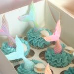 Mermaid cupcakes with edible tail, oyster shell and pearl and waves of swiss meringue buttercream