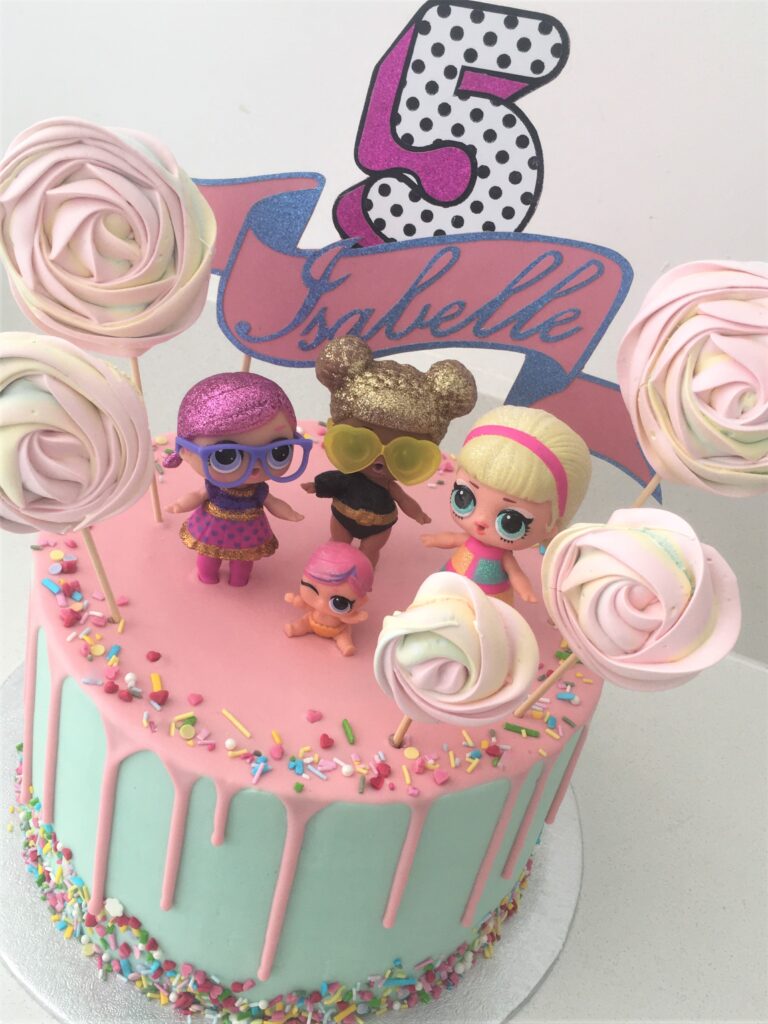 LOL Doll white chocolate drip cake with colourful sprinkles and meringue lollipops