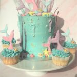 Mermaid cupcakes with edible tail, oyster shell and pearl and waves of swiss meringue buttercream