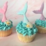 Mermaid cupcakes with edible tail, oyster shell and pearl and waves of swiss meringue buttercream