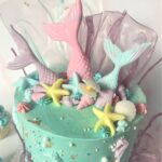 Decorated with pastel fondant tails and seashells with rice paper coral and gold leaf