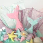 Mermaid Cake decorated with edible fondant tails and seashells with rice paper coral