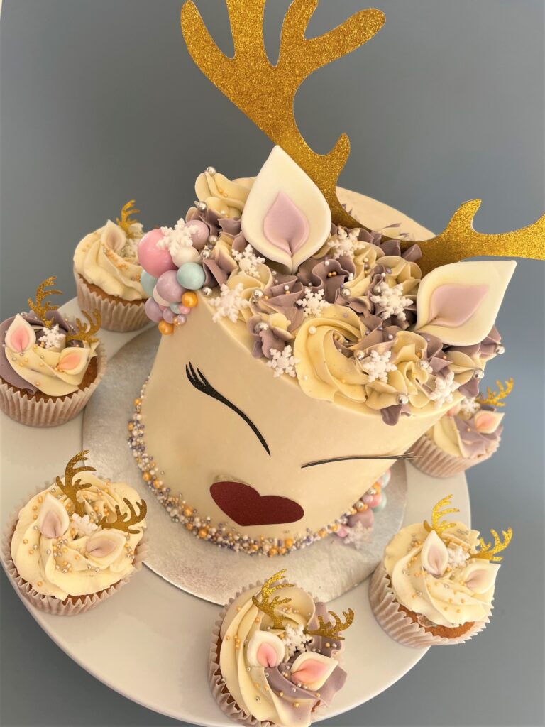 Reindeer Cupcake covered in smooth swiss meringue buttercream decorated with edible ears and snowflake