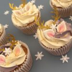 Reindeer Cupcake covered in smooth swiss meringue buttercream decorated with edible ears and snowflake