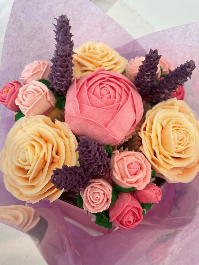 Bouquet of 7 beautifully hand piped floral cupcakes