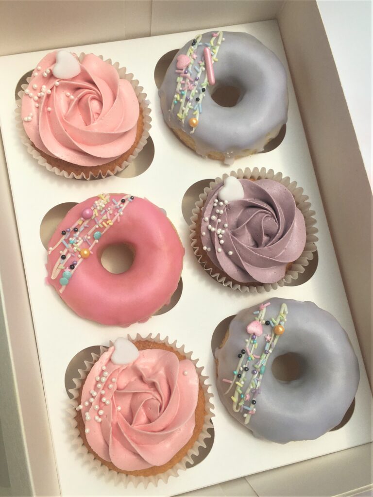 Treat box consisting of your favourite selection of sweet treats from brownies, macarons, cupcakes and doughnuts