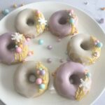 Festive iced doughnut with snowflake and bauble sprinkles