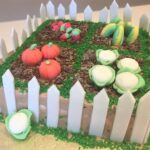 Garden Cake decorated with handmade fondant vegetables/fruit, chocolate mud and grass