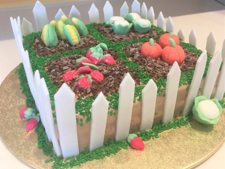 Garden Cake decorated with handmade fondant vegetables/fruit, chocolate mud and grass