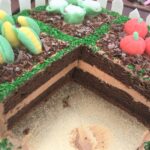 Garden Cake decorated with handmade fondant vegetables/fruit, chocolate mud and grass