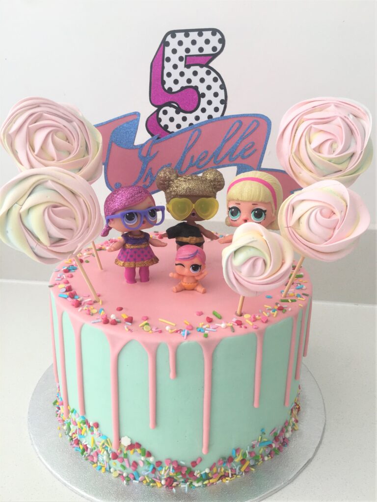 LOL Doll white chocolate drip cake with colourful sprinkles and meringue lollipops