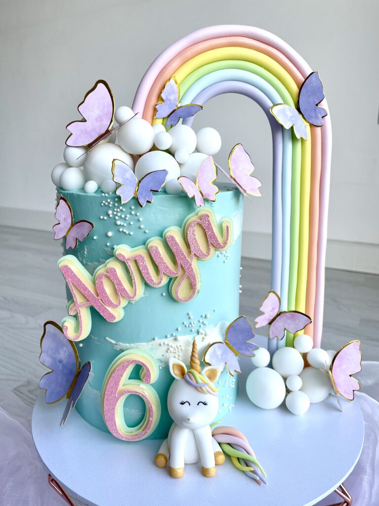 Extra tall extended pastel rainbow with cute unicorn, fondant ball clouds and butterflies